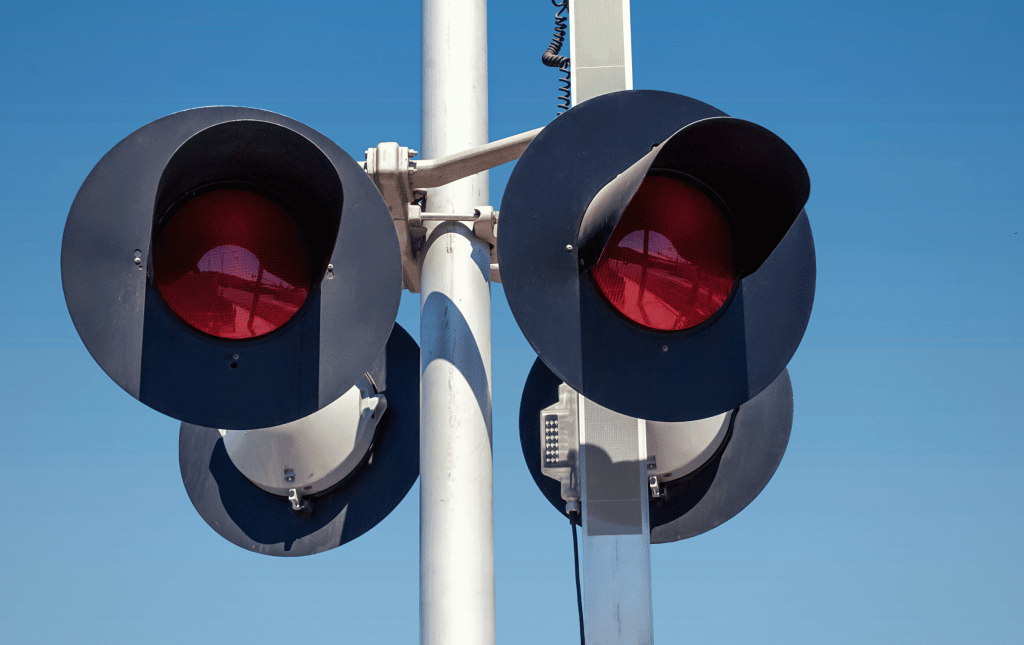 Closeup of rail signal against blue sky