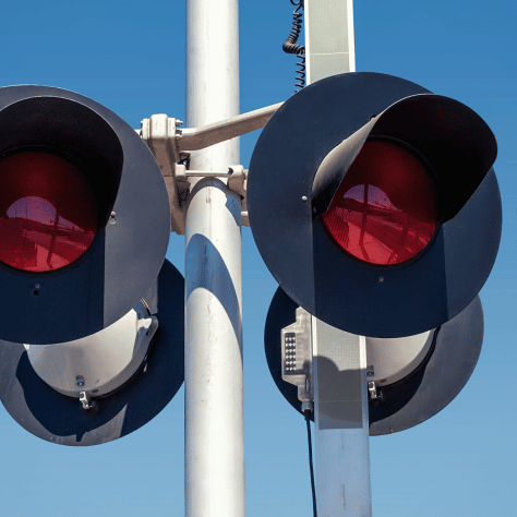 Closeup of rail signal against blue sky