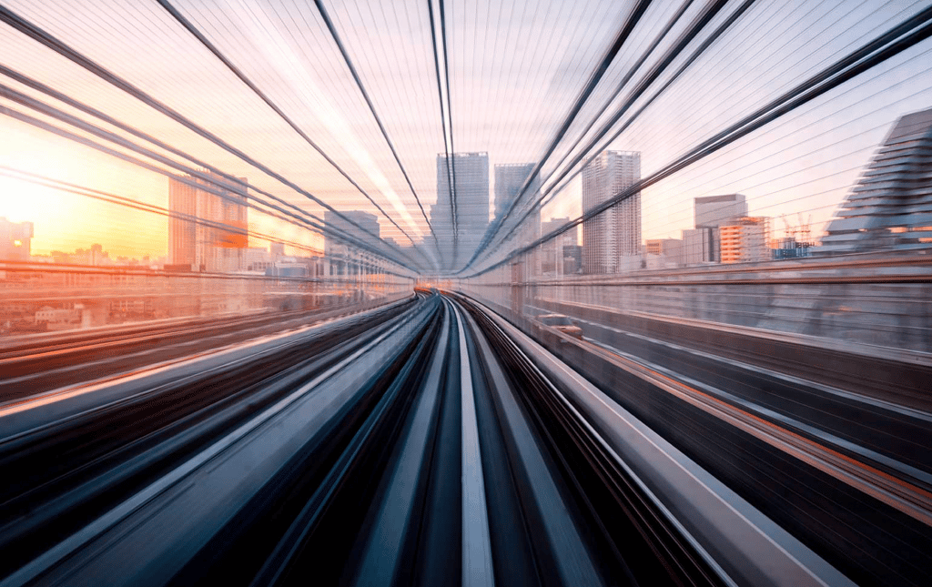 Fast rail through cityscape