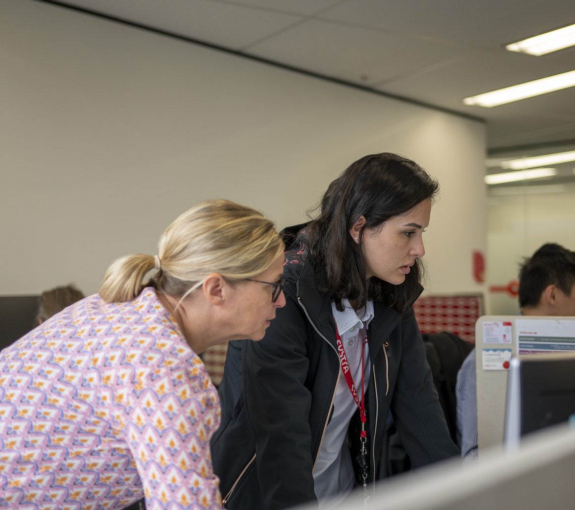 SYSTRA colleagues working together in the Melbourne office