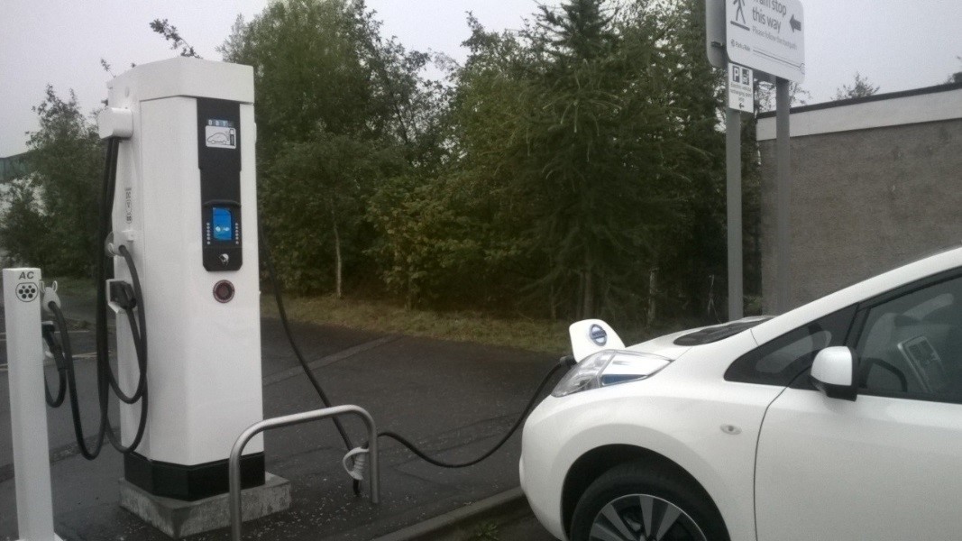 Electric car charging in a car park