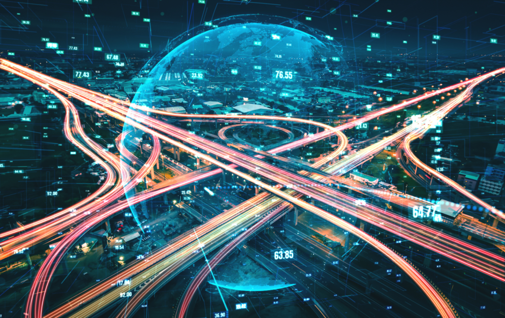 Futuristic road transportation technology and traffic graphic showing digital data transfer / data analysis overlayed. In the centre of the image is a globe.
