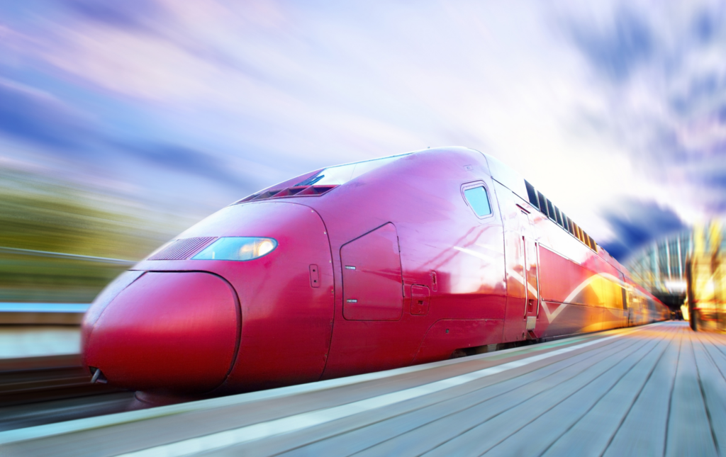 Red high speed rail train in France. Motion blur in background.