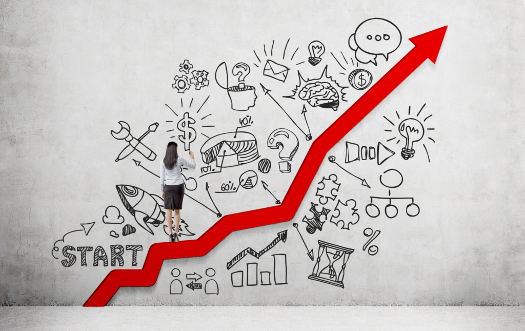 Career development conceptual image - woman walks up red step in the shape of an arrow. She is illustrating career development related sketches on the wall.
