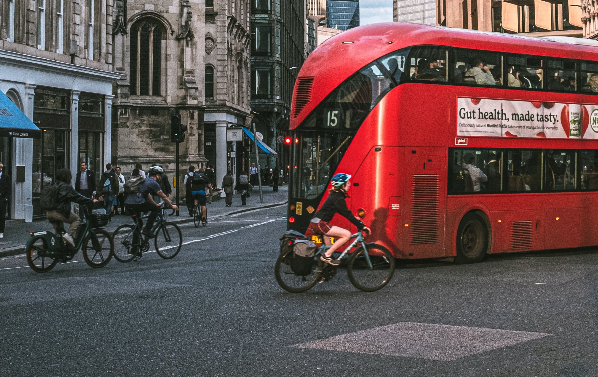 Red double-decker London bus and cyclists in central London