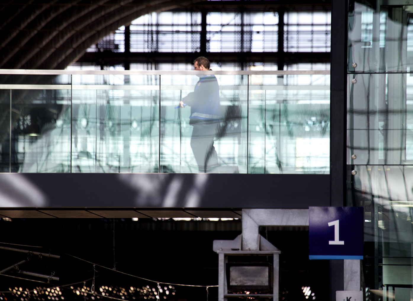 Passenger walking over the bridge at King's Cross station