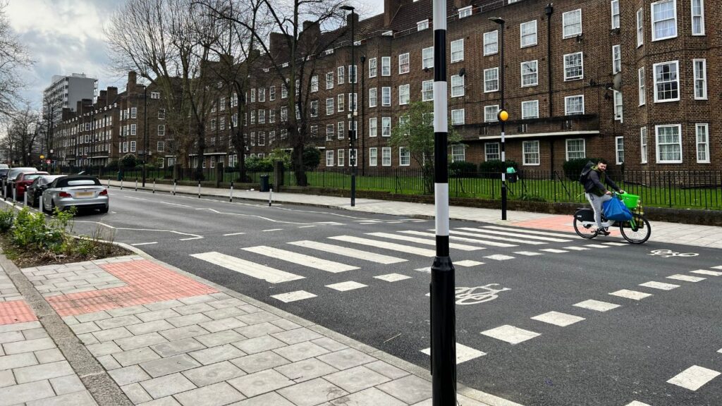 Pedestrian crossing with cyclist along Loughborough Road